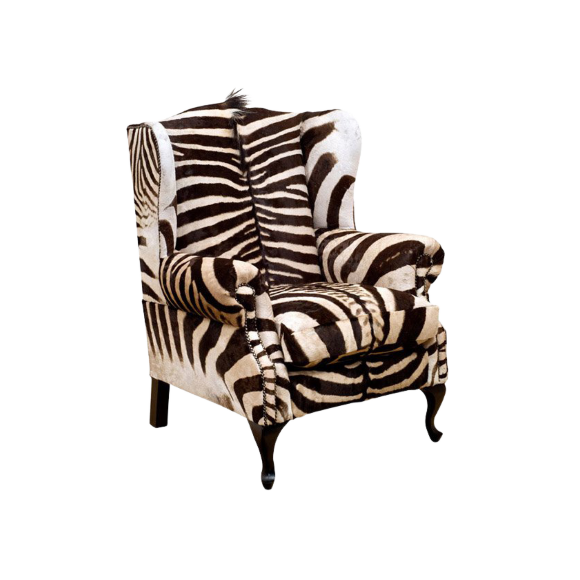Burchell Zebra Wingback Armchair – An African Statement Masterpiece. Elevate your space with this striking wingback armchair, adorned in Burchell Zebra. Crafted to make a bold statement, it is a unique blend of style and African authenticity.  International export of Burchell Zebra available. Customize this masterpiece with your choice of hair-on hides, skins, or fabrics. Pricing available upon request for a truly bespoke creation.