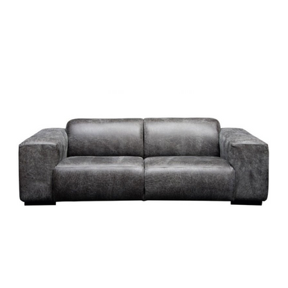 Contemporary Brooklyn Sofa – Embrace the raw, contemporary charm of the Brooklyn sofa. With its bulky design, square lines, and comfortable, relaxed style, it exudes a natural and authentic feel. Upholstered in genuine leather and fabric, this sofa is customizable to your specifications, adding a touch of rugged sophistication to your space.