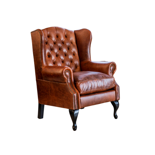 Tufted Chesterfield Wingback Armchair – A timeless favorite and best-seller, this tufted Chesterfield Wingback Armchair is a masterpiece of traditional design. Upholstered in distressed leather and adorned with deep button tufting, these chairs exude distinctive elegance.  Indulge in the luxury of customization with these chairs, custom-made in premium leathers for a truly unique and stylish addition to your space.