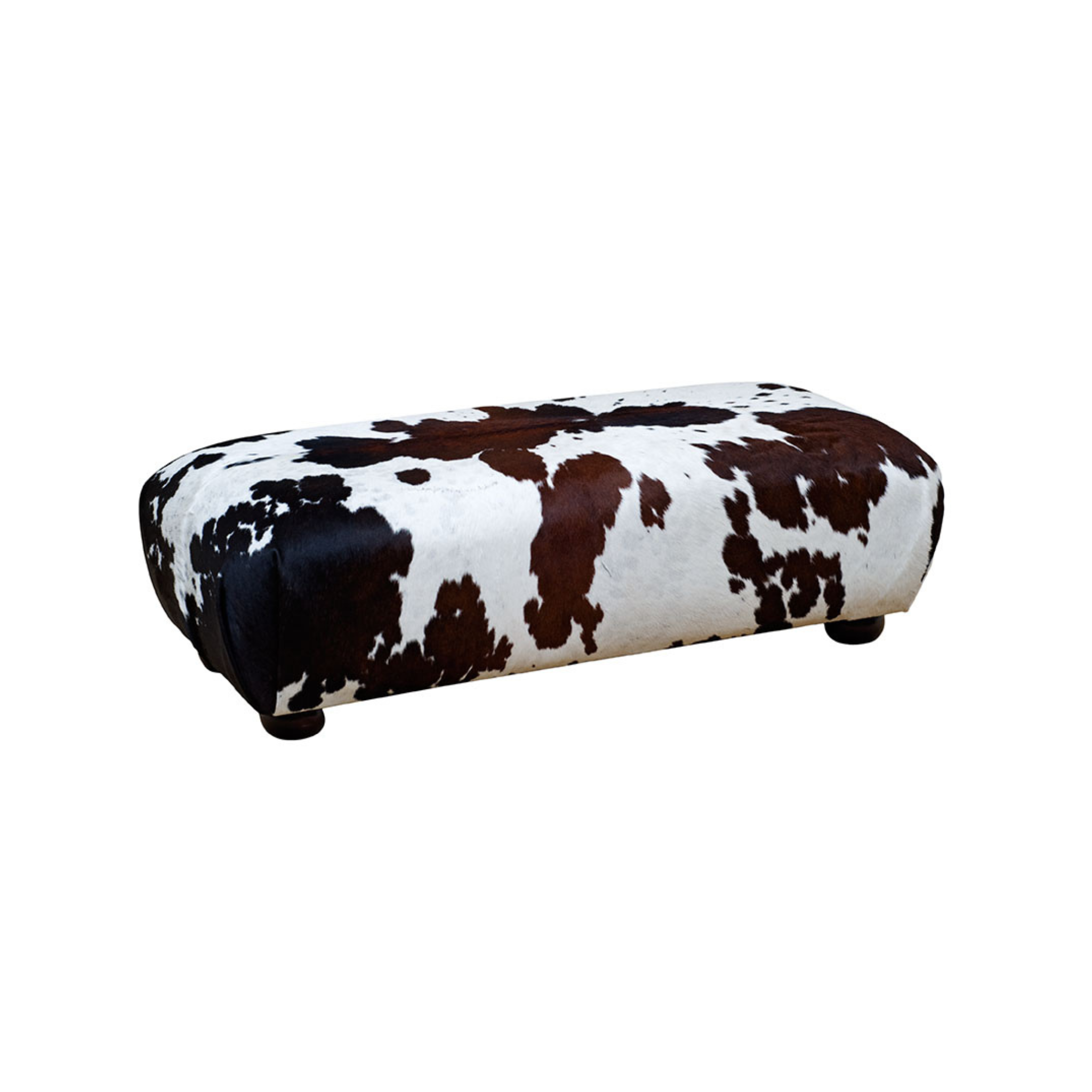 Mbashe Ottoman – A classic ottoman for extra seating, putting your feet up, or placing your drinks tray on. This versatile and beautiful ottoman can be customized in any leather or fabric of your choice.  Featured here in a beautiful Nguni cow hide, you can select your own hides or even use your own. Sizes may vary according to the hides' sizes, ensuring a unique and personalized addition to your space.