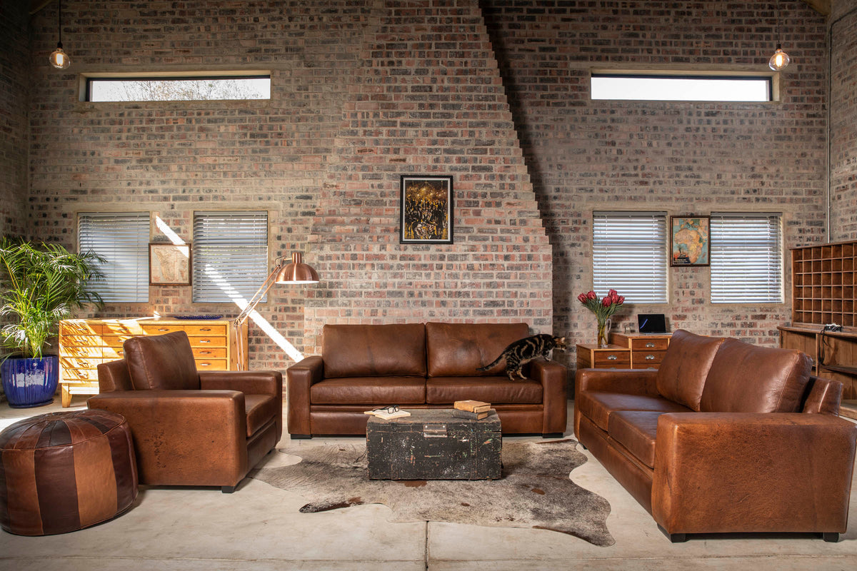 Manhattan Collection – Elevate your space with our versatile Manhattan design, available in Sofas, Daybeds, and Corner Units. Offering a relaxed feel with support in the seat and back, it's the perfect choice for various activities such as watching, listening, reading, or entertaining.  Customize your experience with any size you desire and a wide range of premium leathers and fabrics, capturing your own personal style. Each piece is custom manufactured for a truly unique addition to your living space.